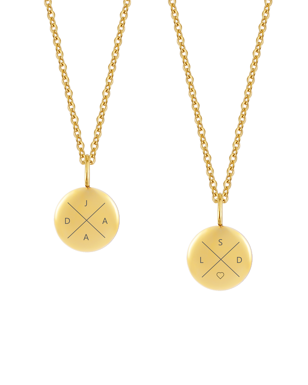 AYA X necklace from byRavn in gold-plated steel, two small pendants with the letters "J D A A" and "S L D ♡" engraved in a cross