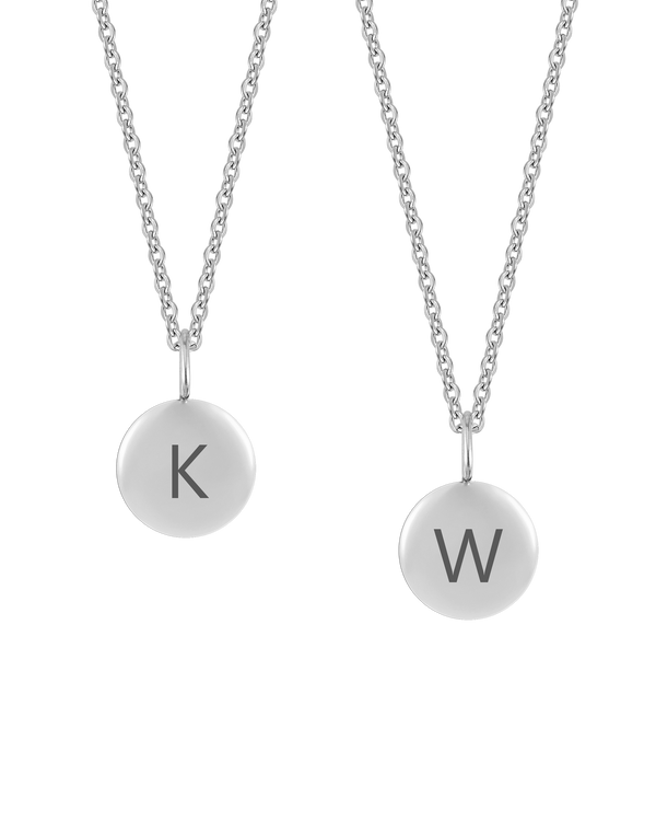 AYA LETTER necklace from byRavn in silver-coloured steel, two small round pendants engraved with the capital letters "K" and "W"