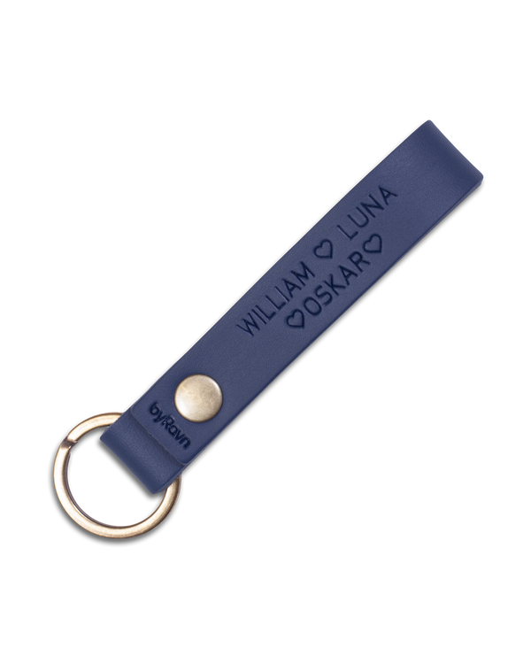BOND leather keyring from byRavn in navy blue with antique brass key ring and the names "William ♡ Luna ♡ Oskar ♡" engraved