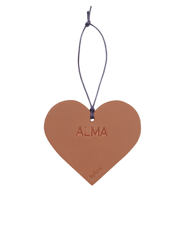 FROST Christmas heart from byRavn in cognac leather with the name "Alma" embossed and black cord hanger
