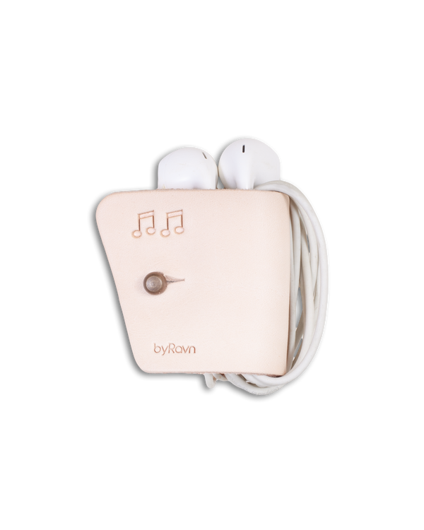 KAX leather earbud holder from byRavn in natural with antique brass sam browne stud and engraved music notes, with earpods