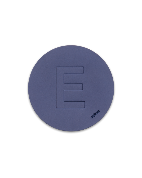 MOKKA leather coaster from byRavn in navy blue embossed with the capital letter "E"