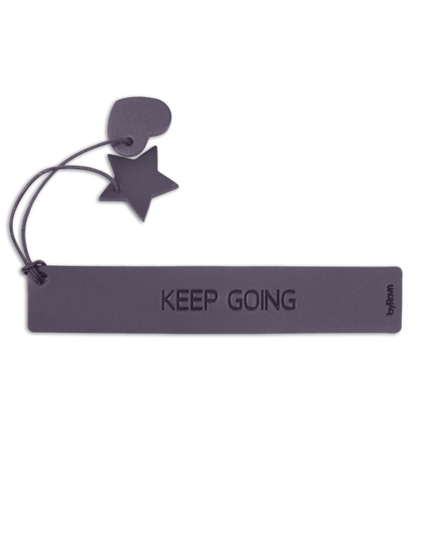 PAGE bookmark from byRavn in dark brown leather with the engraving "Keep going" and leather heart and star on a cord