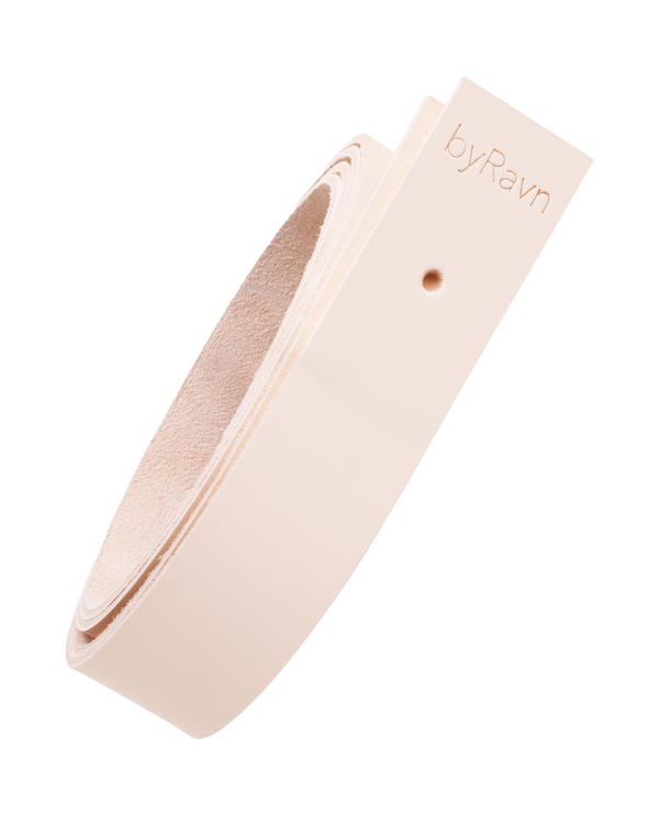 WAVE leather strap from byRavn in natural full-grain leather, rolled up, with byRavn embossing and mounting hole