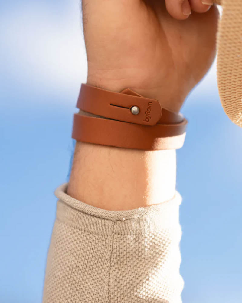 DUO leather bracelet in cognac wrapped twice around the wrist, seen from the inside with press stud and byRavn embossing