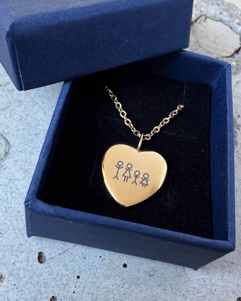 LUV STICK necklace in gold-plated stainless steel engraved with a matchstick family of four, resting in a navy blue gift box