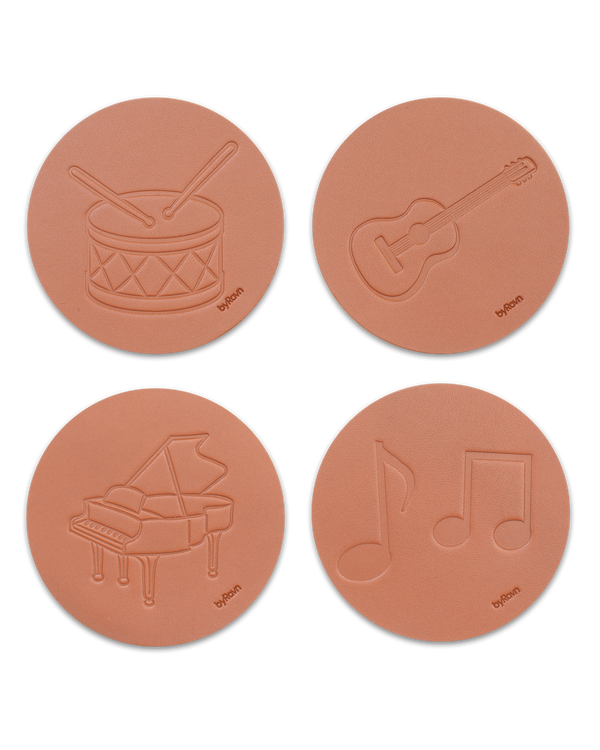 MOKKA music coasters from byRavn in cognac leather, 4 motifs: drum, guitar, grand piano and sheet music