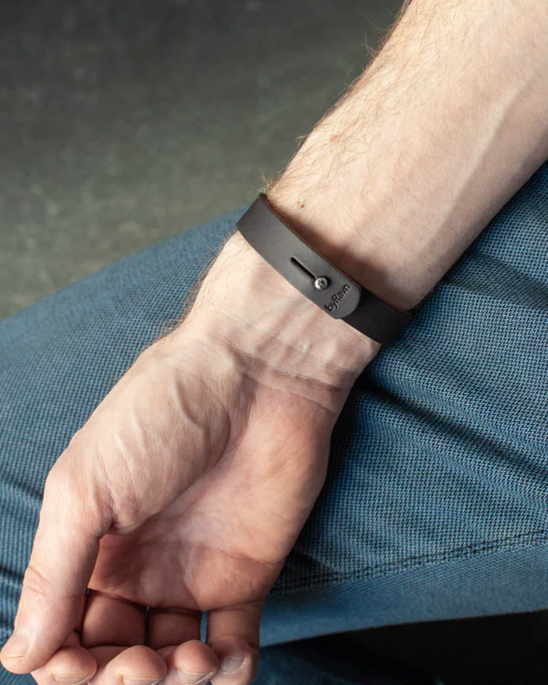 MONO leather bracelet in dark brown seen from the inside with steel press stud and byRavn embossing on the wrist