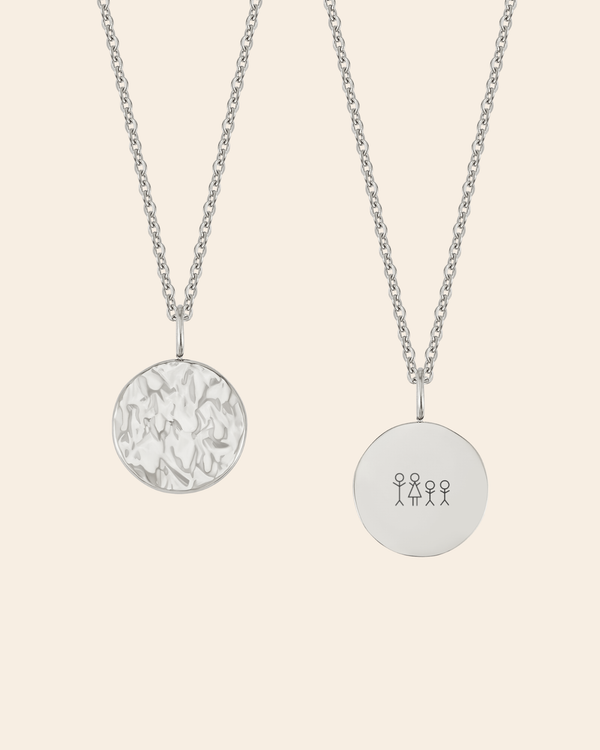 MOON STICK necklace in silver-coloured stainless steel on cream background, hammered coin and coin engraved with matchstick family of four