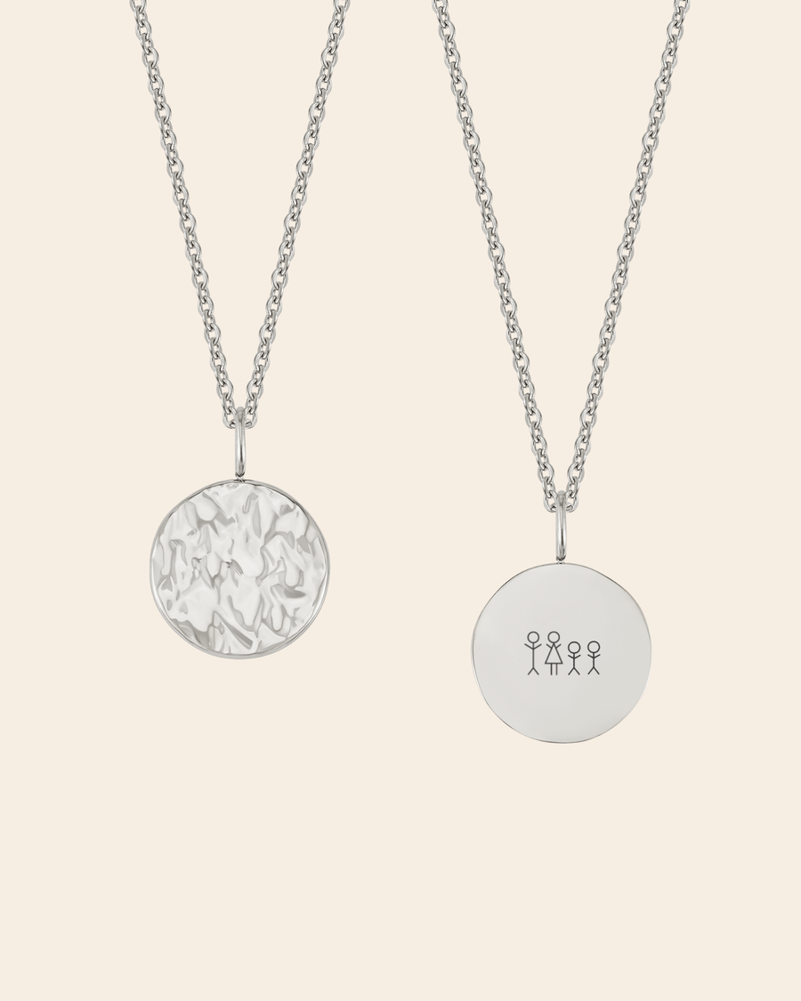 MOON STICK necklace in silver-coloured stainless steel on cream background, hammered coin and coin engraved with matchstick family of four