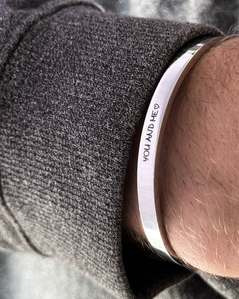 MARS SCRIPT bracelet in silver-coloured stainless steel, handwritten engraving "You and me" ♡, worn with a dark grey knit
