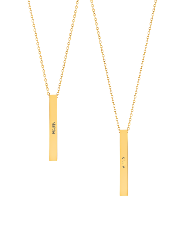 NEO necklace from byRavn in gold-plated steel, two elongated bar pendants with the name "Malthe" and "S ♡ A" engraved lengthwise