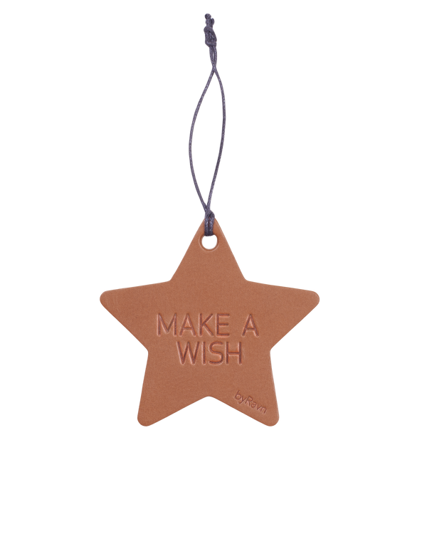 NORTH Christmas star from byRavn in cognac leather with the engraving "Make a wish" and black cord hanger
