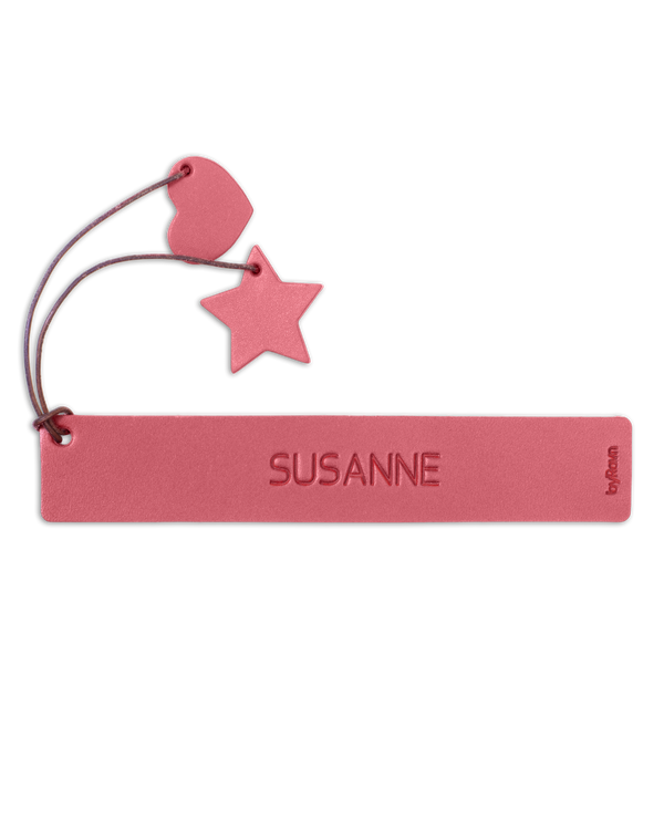 PAGE bookmark from byRavn in red leather with the name "Susanne" engraved and leather heart and star on a cord