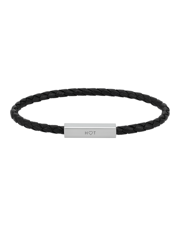 RIO leather bracelet from byRavn in black braided leather with steel clasp and the initials "H ♡ T" engraved