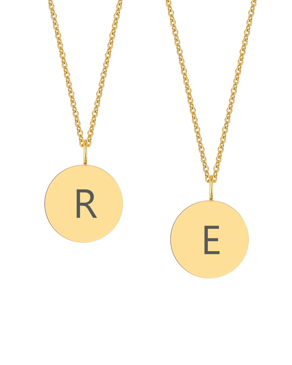 SIA LETTER necklace from byRavn in gold-plated stainless steel, two round pendants engraved with the capital letters "R" and "E"