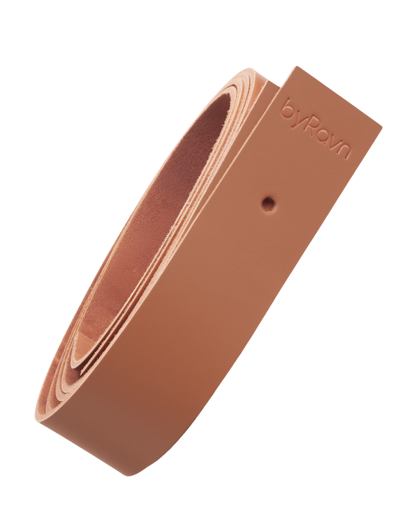 WAVE leather strap from byRavn in cognac full-grain leather, rolled up, with byRavn embossing and mounting hole